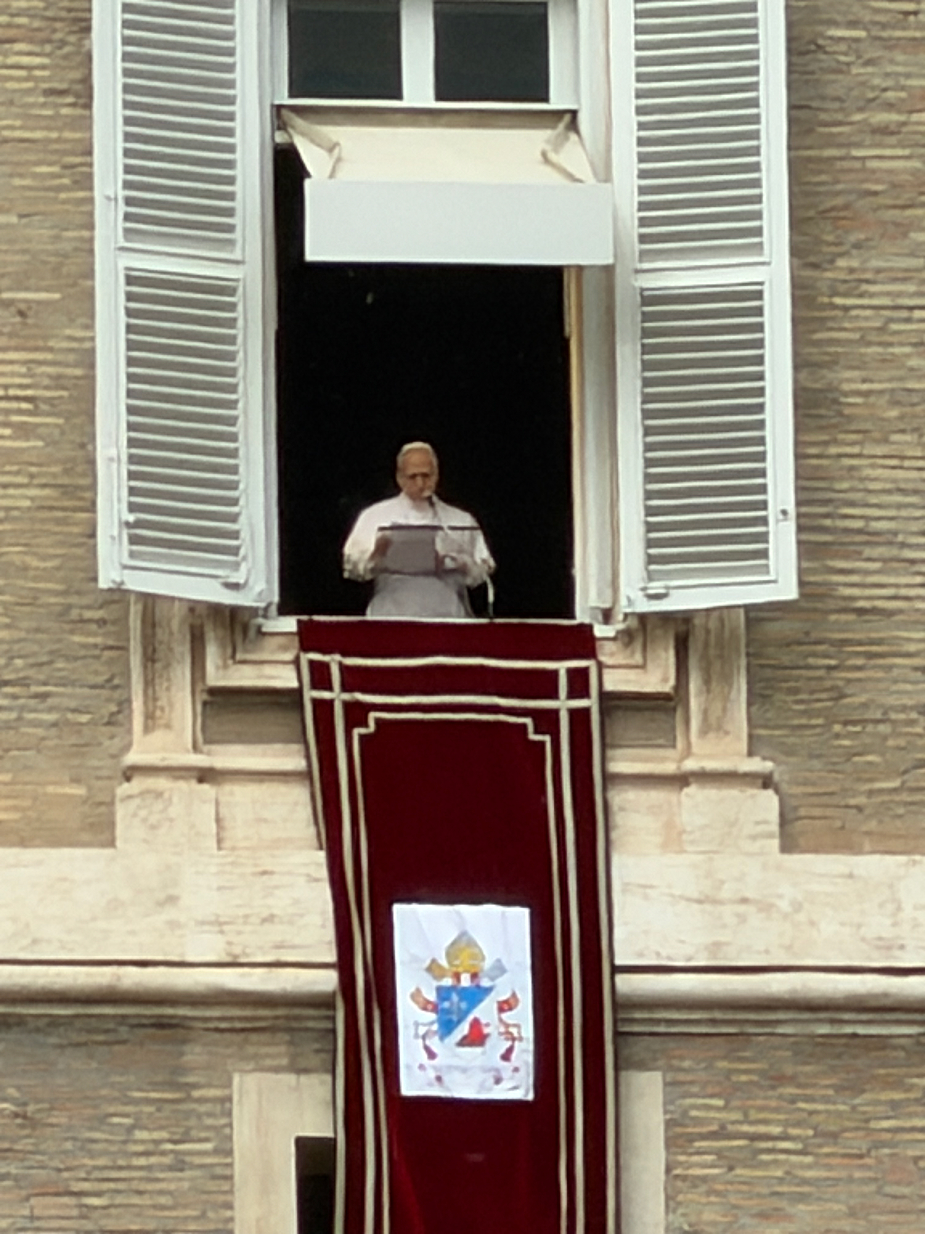 Pope Leo XIV speaks from the window of the Apostolic Palace